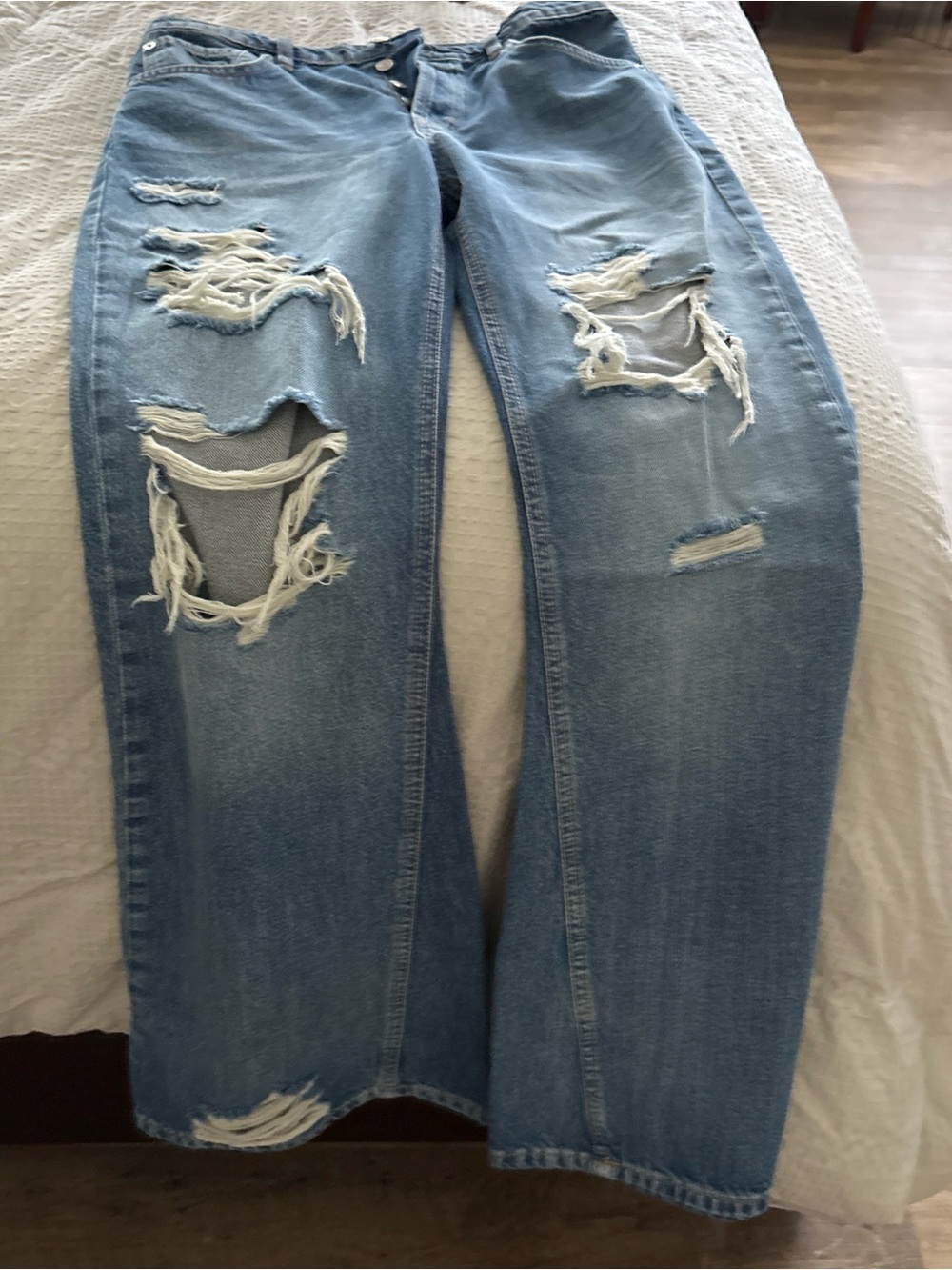 We The Free light blue denim jeans with tan stitching